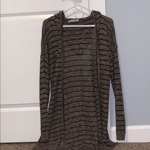 It’s a brown and dark brown cardigan with a hood